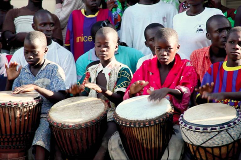 Students playing Djembé