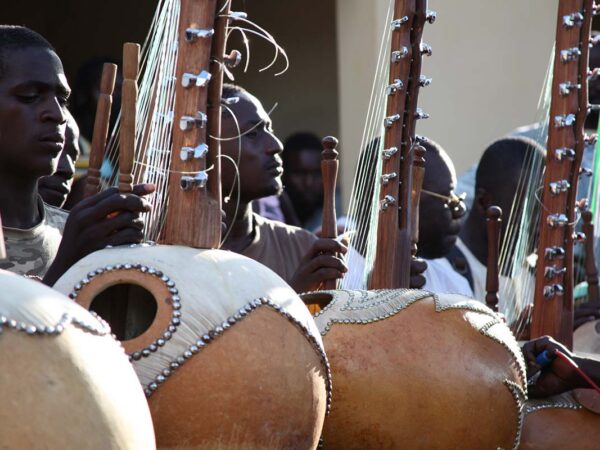 People in Kirina playing Kora